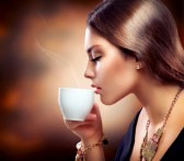 15892346-beautiful-girl-drinking-tea-or-coffee
